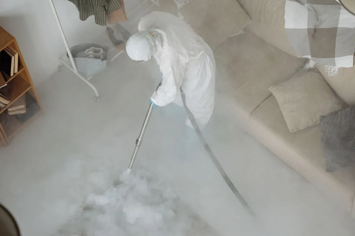 Biohazard cleanup technician in protective equipment, Basin City, WA